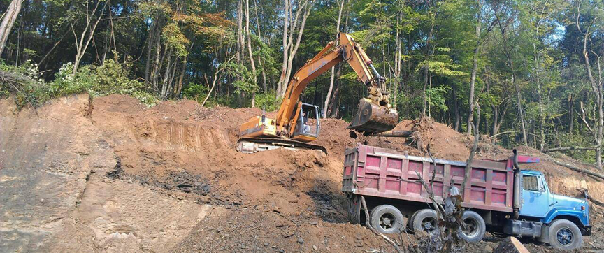 Excavator and dump truck